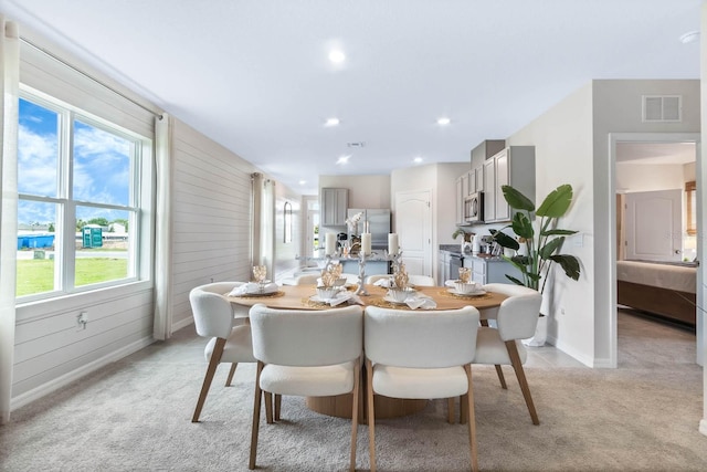 view of carpeted dining area