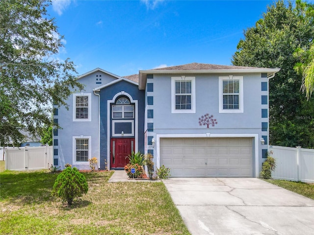 view of front of home with a garage and a front yard