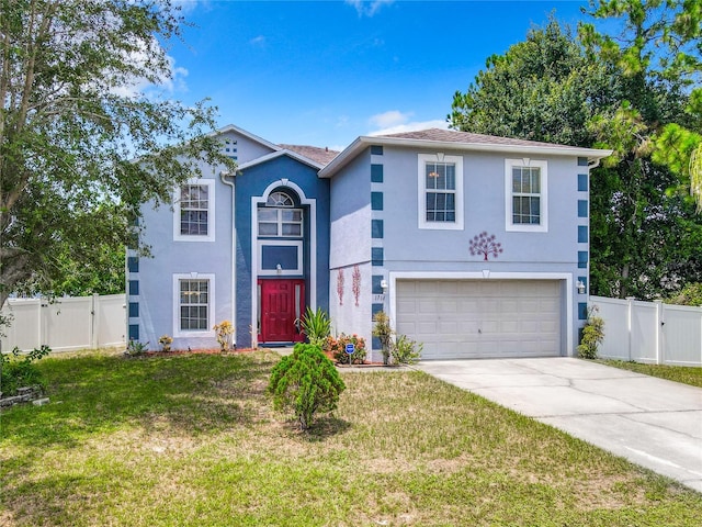 view of front of home featuring a front lawn and a garage