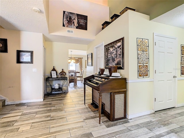 hallway featuring a textured ceiling