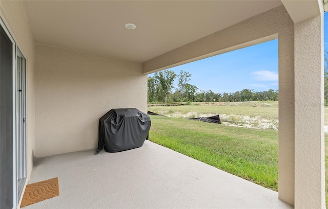 view of patio featuring a grill