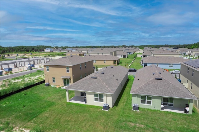 birds eye view of property with a residential view