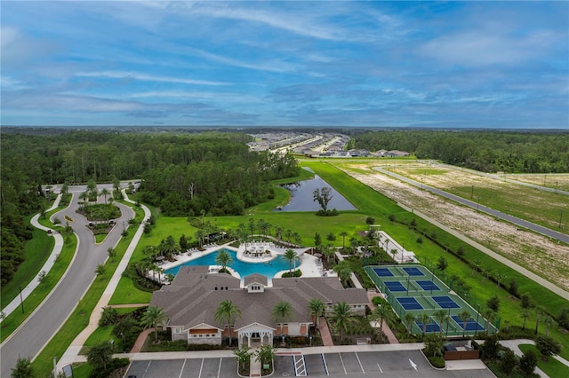 bird's eye view with a water view and a forest view