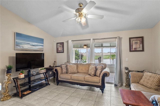 living room featuring lofted ceiling, ceiling fan, baseboards, and light tile patterned flooring