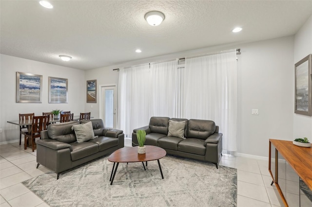 tiled living room with a textured ceiling