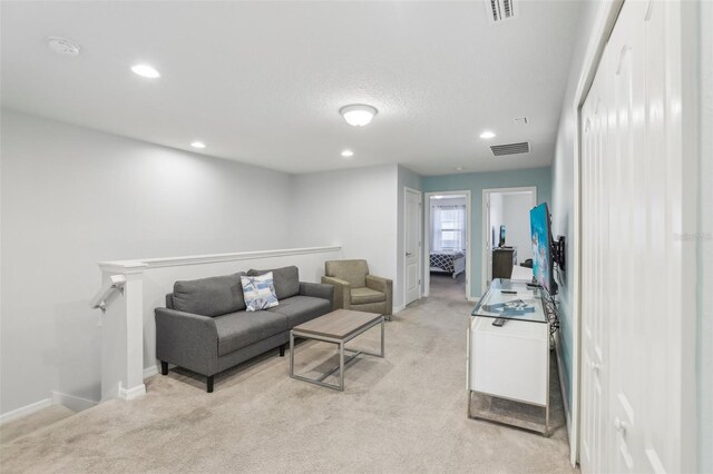 living room featuring light carpet