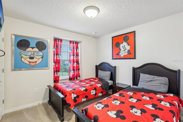 carpeted bedroom featuring a textured ceiling