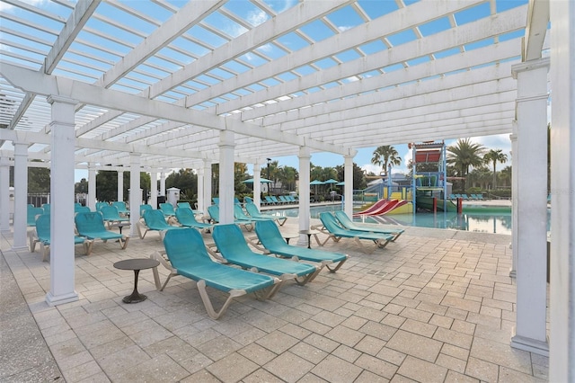 view of patio / terrace featuring a pergola and a playground