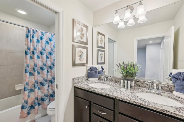 full bathroom with vanity, toilet, and shower / bath combo with shower curtain