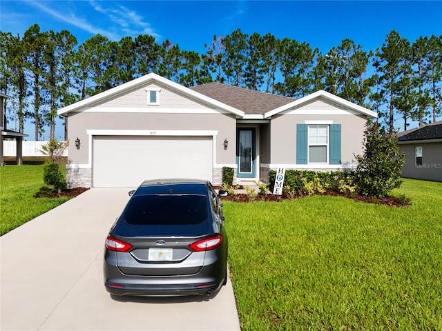 ranch-style house featuring a front lawn and a garage