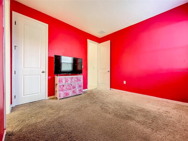 unfurnished bedroom featuring carpet floors