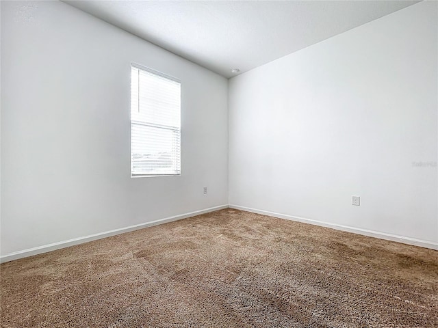 unfurnished room featuring carpet floors