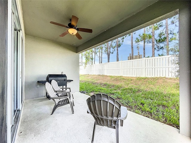 view of patio featuring ceiling fan