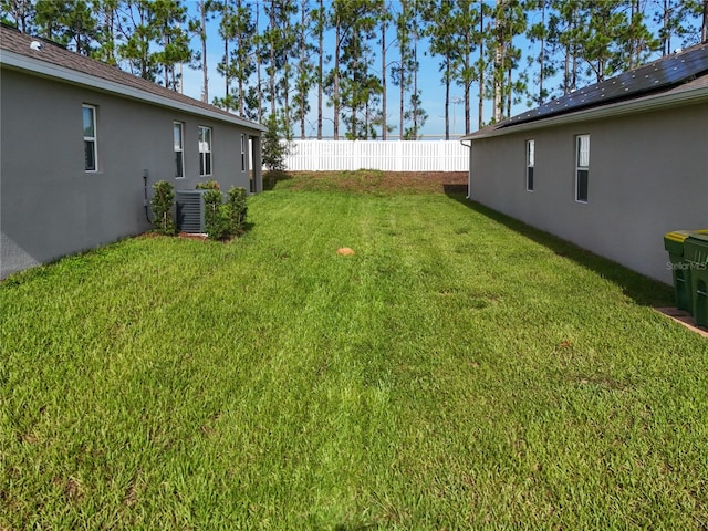 view of yard with central AC unit