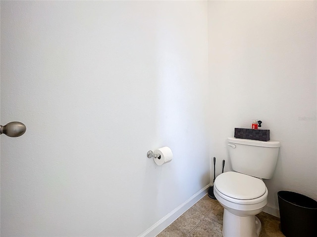 bathroom featuring tile patterned flooring and toilet