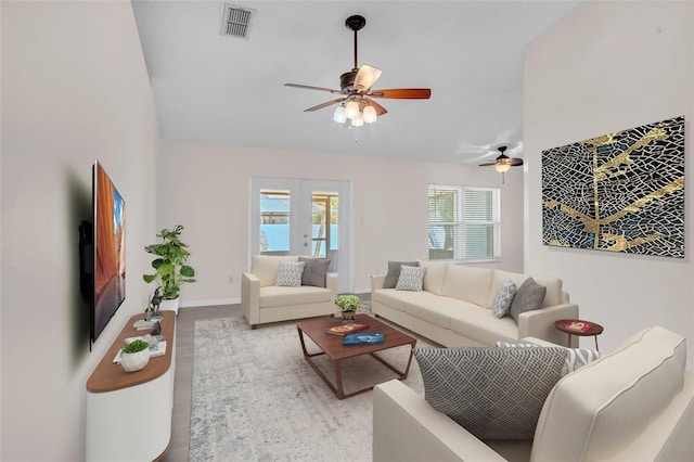 living room featuring light wood-type flooring and ceiling fan