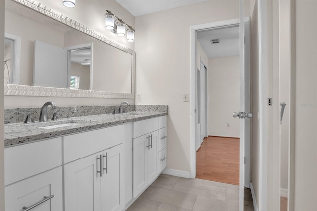 bathroom with vanity and tile patterned floors