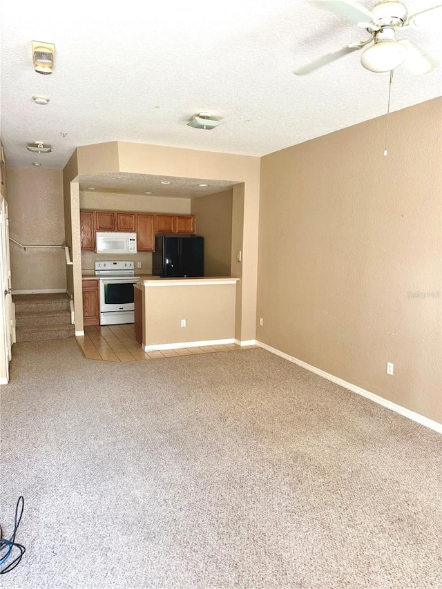 unfurnished living room featuring light tile patterned flooring, a textured ceiling, and ceiling fan