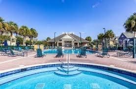 view of swimming pool with a patio area