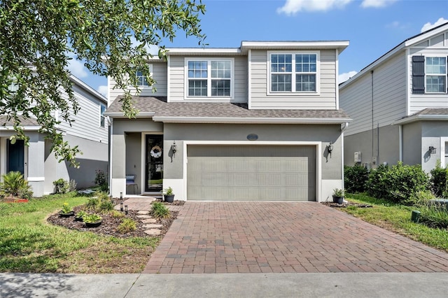 view of front of property with a garage