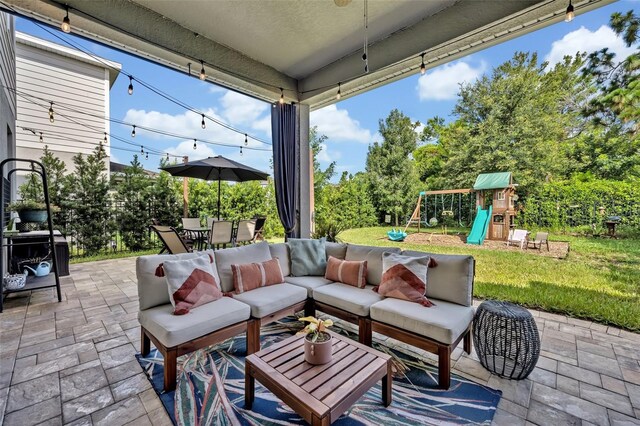 view of patio / terrace with a playground and outdoor lounge area