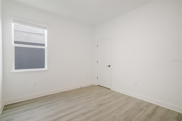 spare room with light wood-type flooring