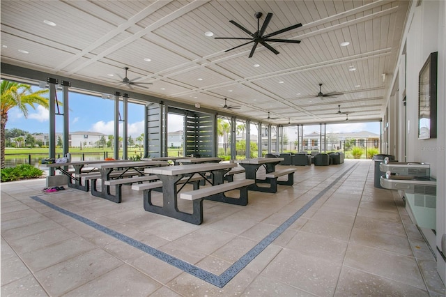 exterior space featuring ceiling fan