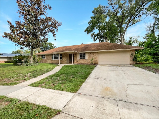 single story home with a garage and a front yard