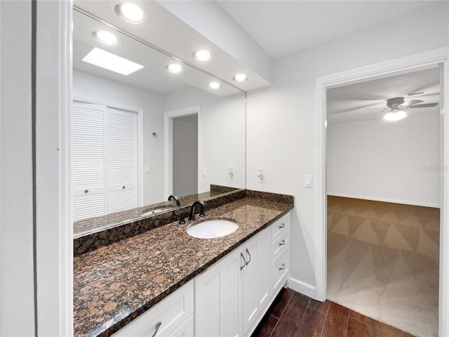 bathroom with vanity and ceiling fan