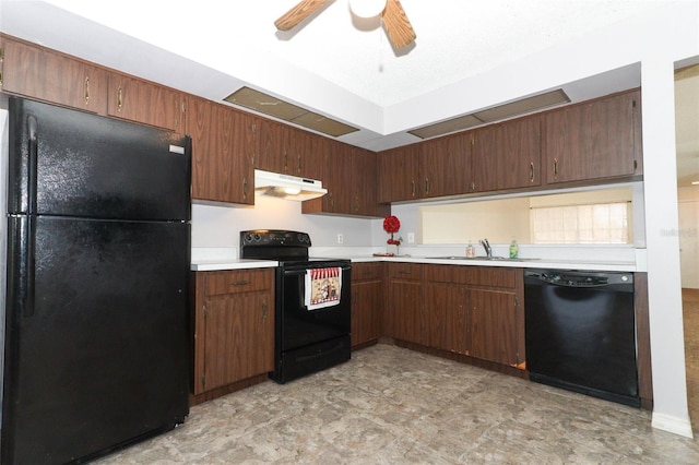 kitchen featuring ceiling fan, under cabinet range hood, a sink, light countertops, and black appliances