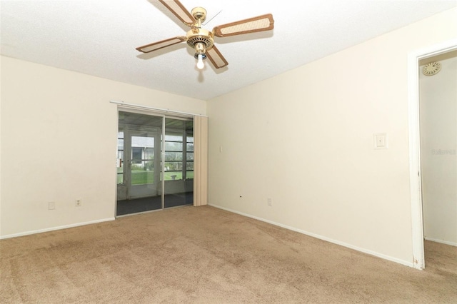 unfurnished room with ceiling fan, baseboards, and light colored carpet