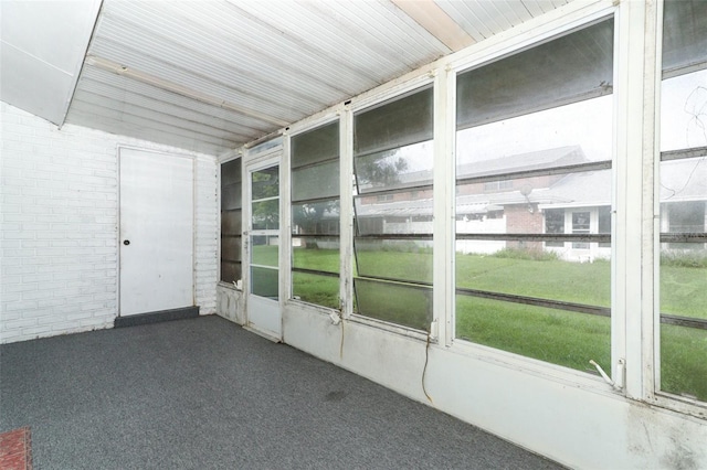 unfurnished sunroom with plenty of natural light