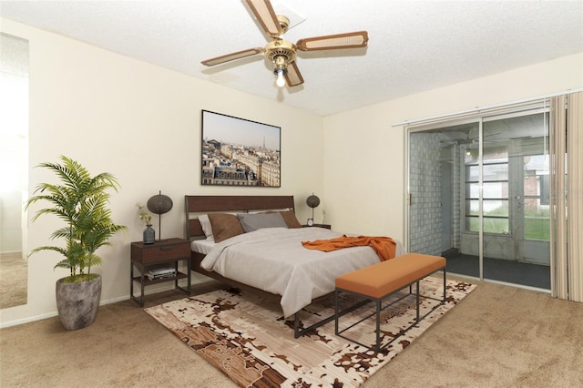 carpeted bedroom with a ceiling fan, access to outside, baseboards, and a textured ceiling