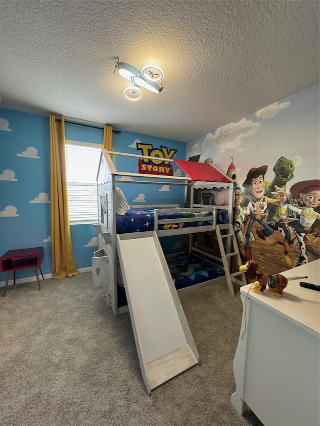 bedroom with carpet flooring and a textured ceiling