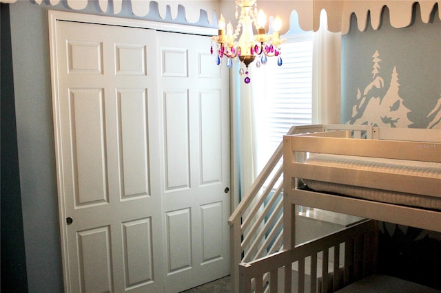 bedroom with a chandelier and a closet