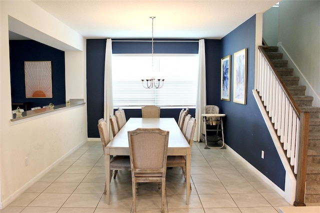 dining area featuring a notable chandelier and light tile patterned floors