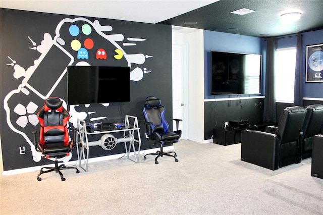 carpeted office space featuring a textured ceiling