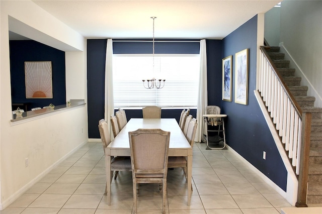 dining room featuring a chandelier and light tile patterned floors