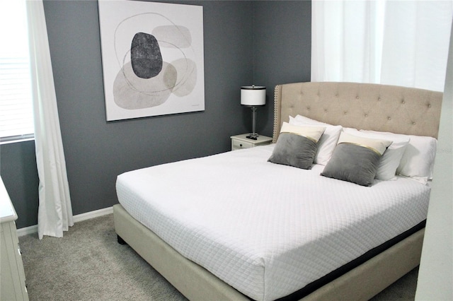 bedroom featuring light colored carpet