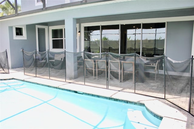 view of swimming pool with a patio