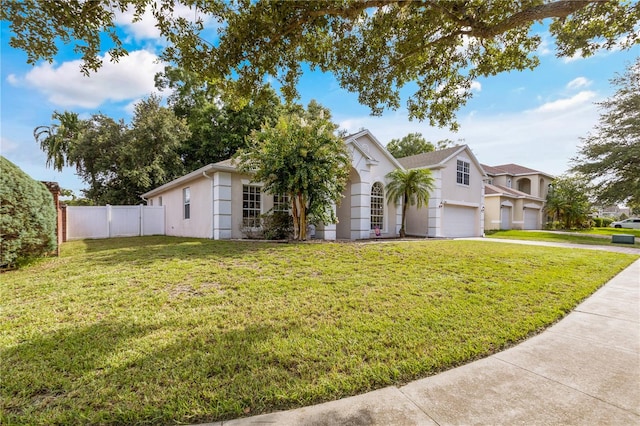 view of front of property with a garage and a front lawn