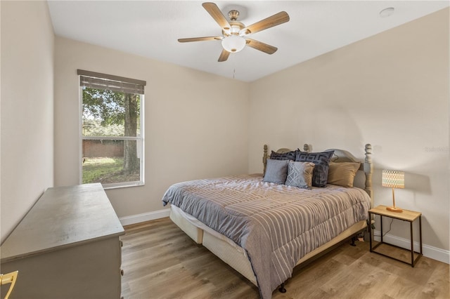 bedroom featuring light wood-type flooring and ceiling fan