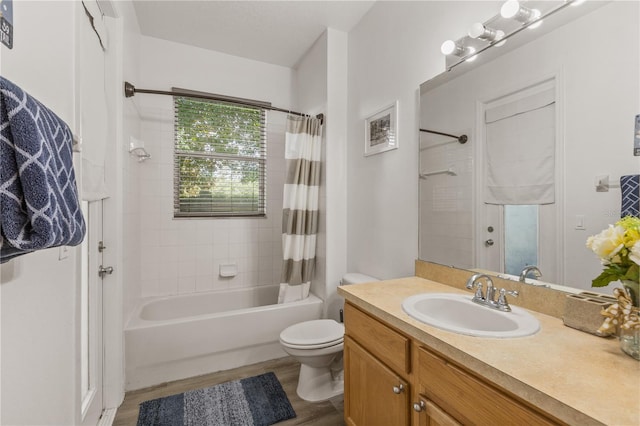 full bathroom with vanity, shower / bathtub combination with curtain, and toilet