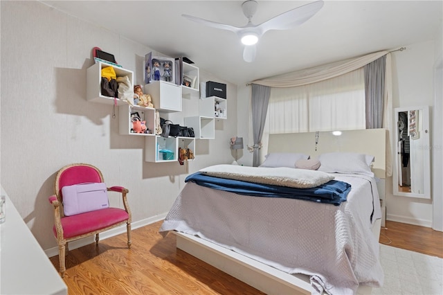 bedroom featuring light wood-type flooring and ceiling fan