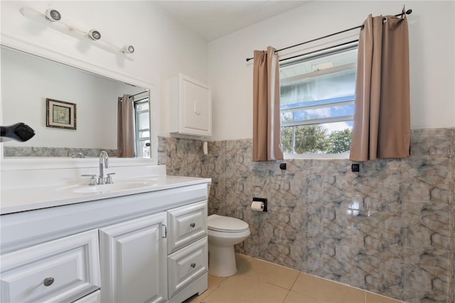 bathroom with vanity, tile walls, toilet, and tile patterned floors