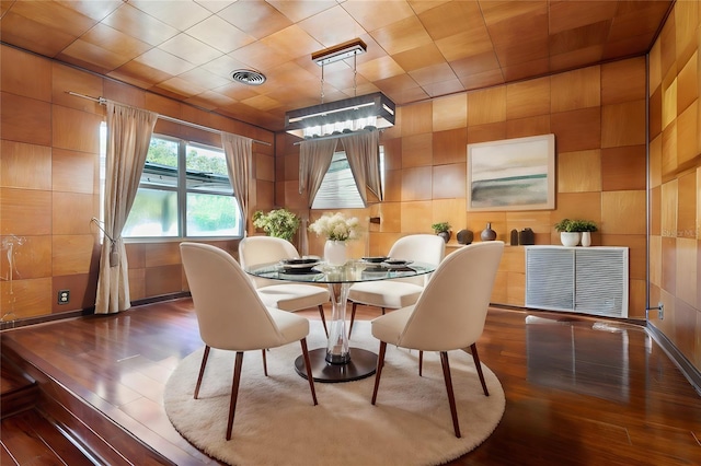 dining area with hardwood / wood-style floors