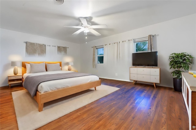 bedroom featuring ceiling fan and dark hardwood / wood-style flooring