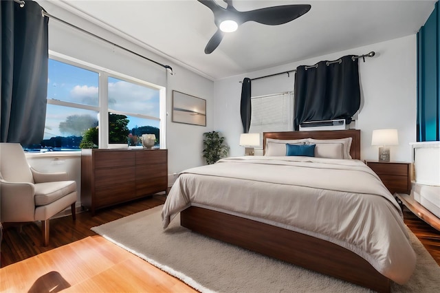 bedroom with dark wood-type flooring and ceiling fan