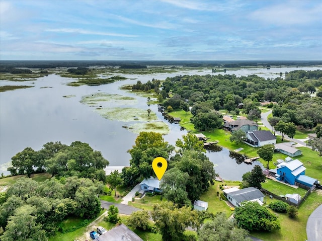 birds eye view of property featuring a water view