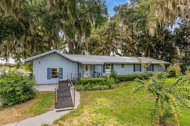 ranch-style house with a front lawn